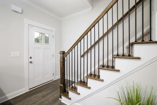 Stylish baseboards conceal gaps and guard walls against daily impacts.